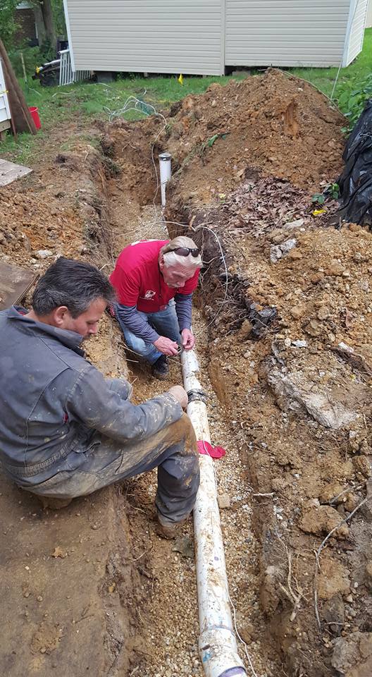 Davis Plumbing & Heating technicians repairing a water line